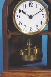 German Wood Cased Disk Pendulum Clock