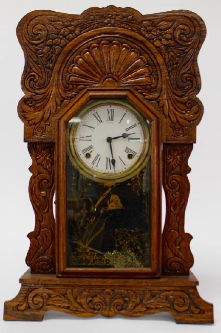 Late 19th century pressed Oak case gingerbread clock by Sessions Clock Co