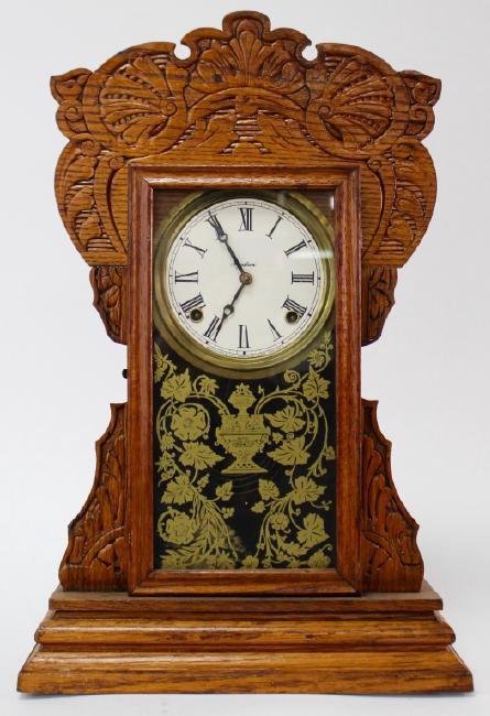 Late 19th century American pressed Oak case gingerbread clock by E. Ingraham Clock Co