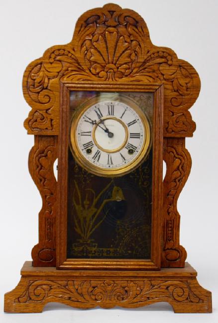 Late 19th to Early 20th century pressed Oak case gingerbread clock by Sessions Clock Co