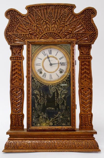 Late 19th century American pressed Oak case gingerbread clock by E. Ingraham Clock Co