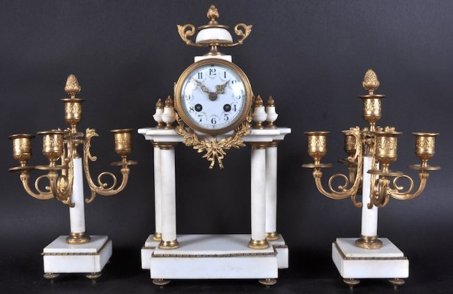 A FRENCH WHITE MARBLE AND ORMOLU THREE PIECE CLOCK