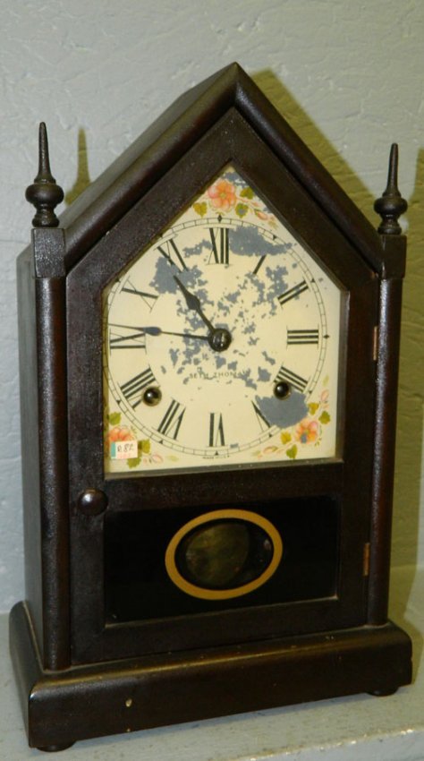 Seth Thomas steeple clock. 15 1/2″ x 9 1/4″.