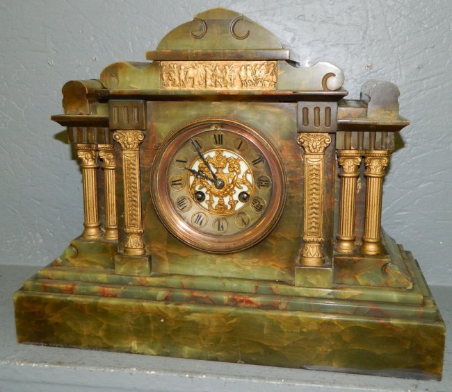 French marble clock with brass and enamel face.