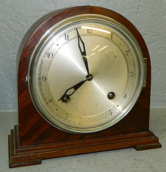 Dome top mahogany case English 8 day clock.