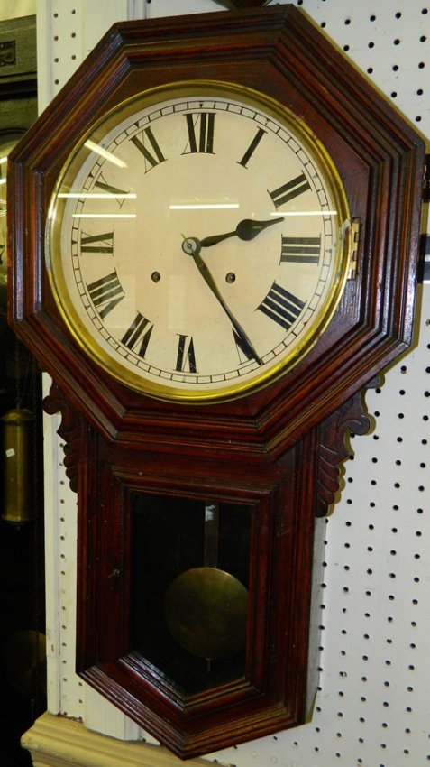 Walnut Schoolhouse clock.  31″ x 17″.