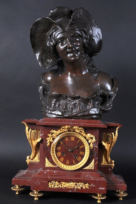 A 19TH CENTURY VEINED MARBLE AND ORMOLU CLOCK,
