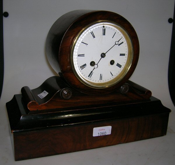 A WALNUT DRUM HEAD CLOCK