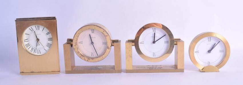 FOUR TIFFANY & CO BRASS DESK CLOCKS in various forms