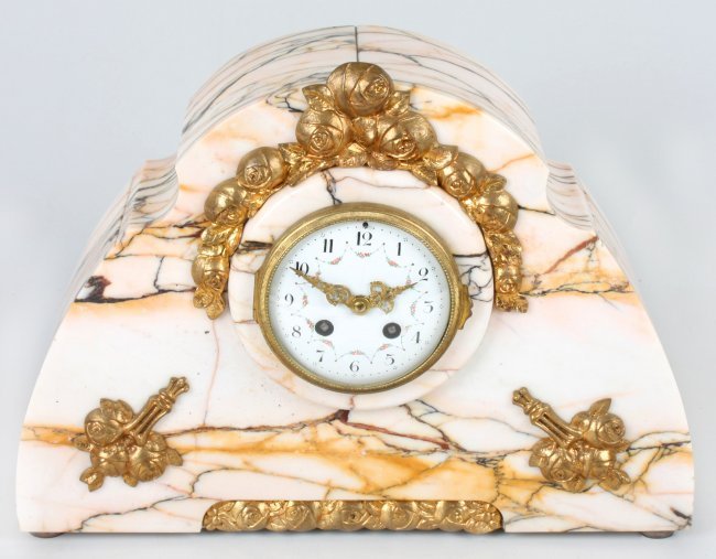 An Art Deco style veined marble mantel clock