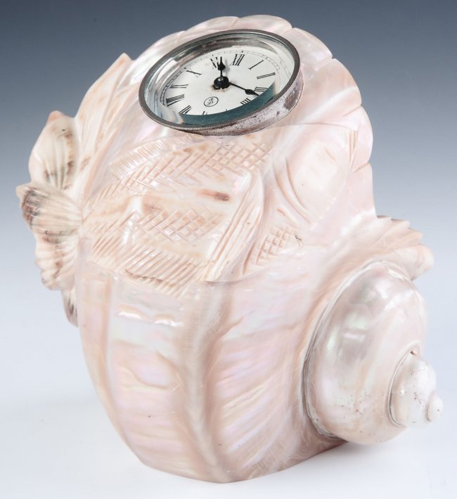 A SETH THOMAS CLOCK MOUNTED IN A LARGE SEA SHELL