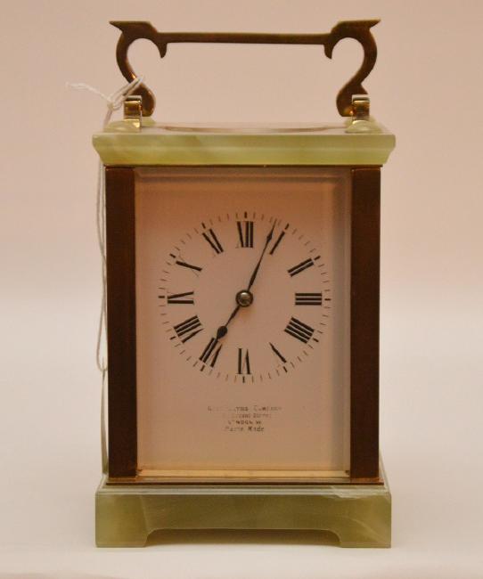 French Brass & Onyx Carriage Clock with swing handle.