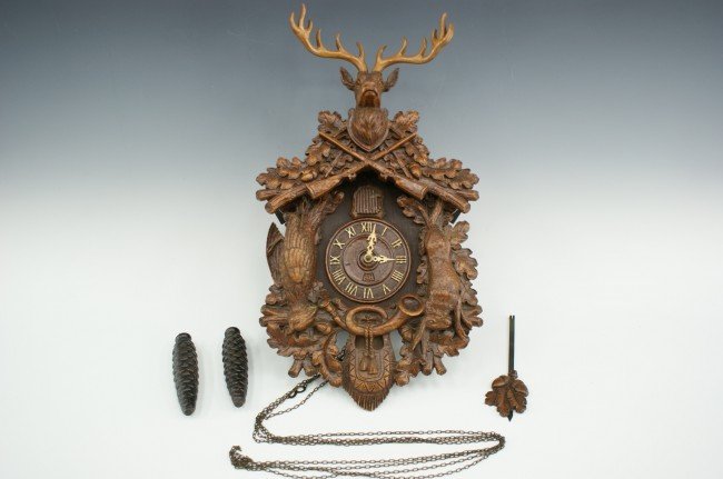 A LUX NOVELTY ‘HUNTING SCENE’ CUCKOO CLOCK