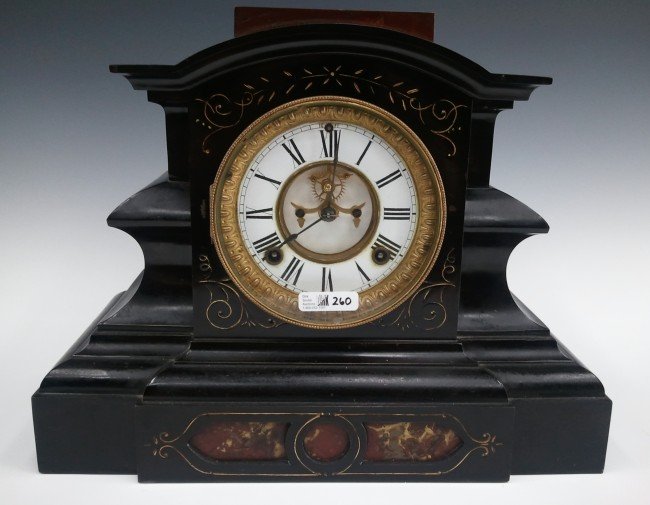 AN UNUSUAL ANSONIA IRON CASE BLACK MANTEL CLOCK