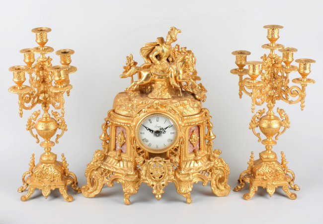 A French-style gilt spelter three-piece clock set