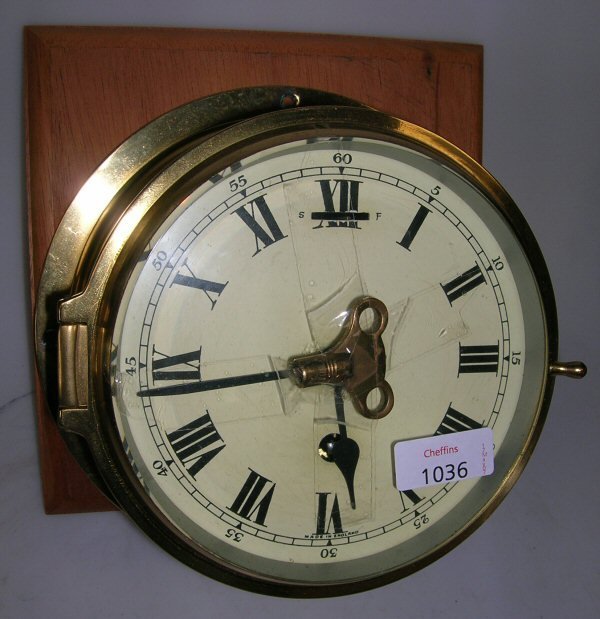 A BRASS CASED SHIPS TYPE CLOCK