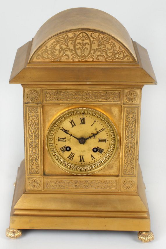 A late 19th century French brass mantel clock