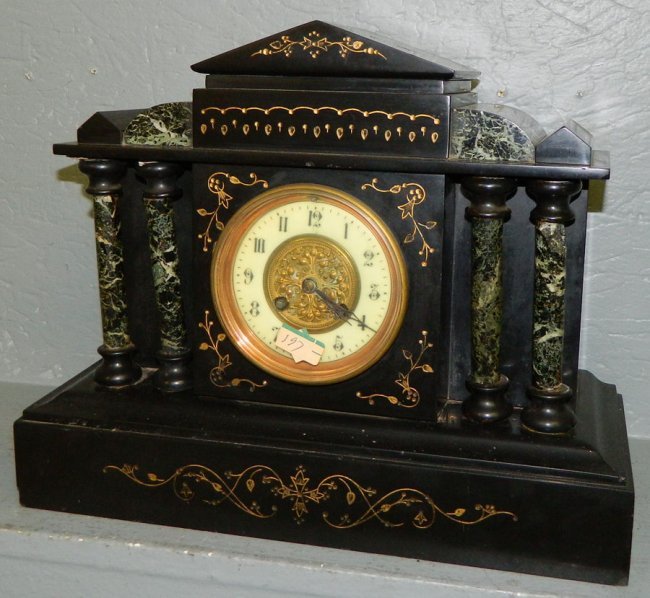 Marble 8 day mantle clock w/ brass center plate.