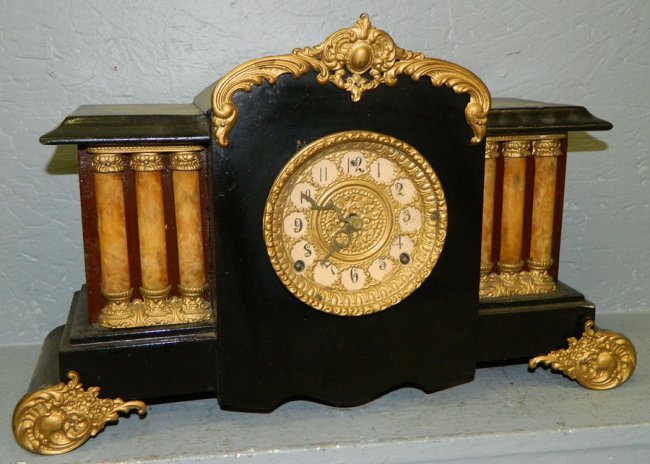 American Victorian shelf clock with gold paint .