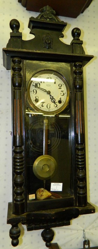 Viennese 8 day pendulum clock w/cameo detail.