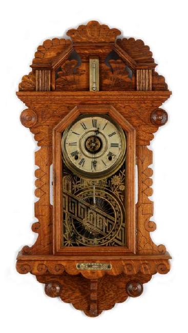 A WATERBURY CROWN HANGING KITCHEN CLOCK