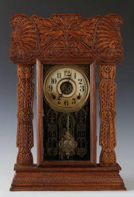 AN INGRAHAM ‘ATLANTIC’ GINGERBREAD KITCHEN CLOCK