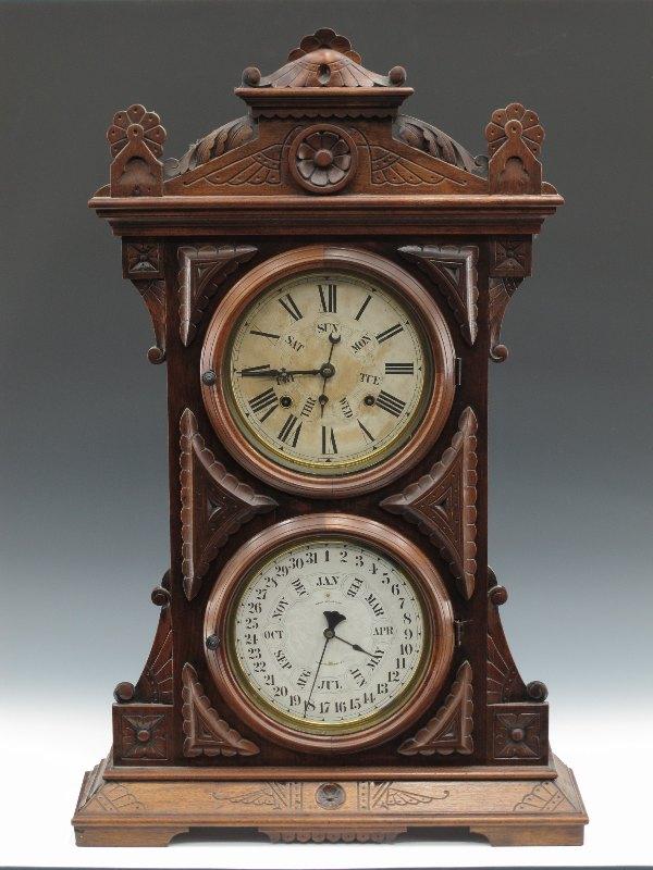 A WELCH SPRING & CO AUDRAN DOUBLE DIAL CALENDAR CLOCK