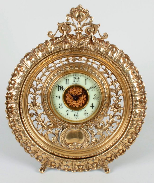 A cast brass strut clock