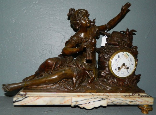 Marble 8 day clock w/mythological sculpture.