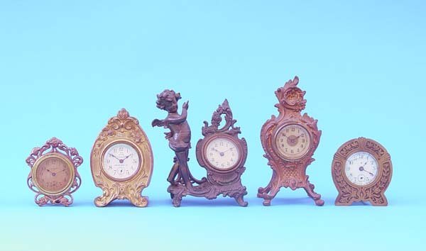 Five Small American Gilt Metal Novelty Clocks