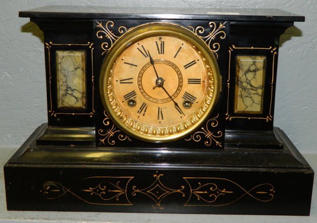 Ansonia 8 day iron clock w/painted plaques.
