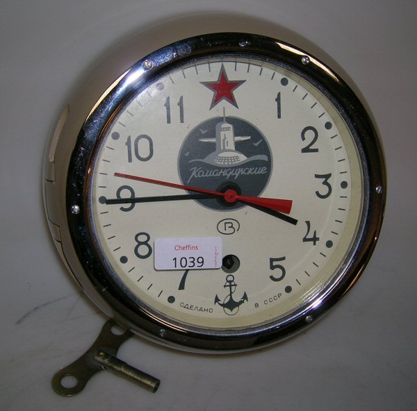 A RUSSIAN PAINTED CASED SUBMARINE CLOCK