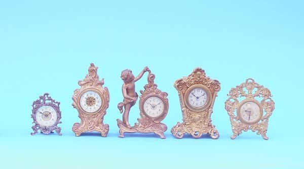 Five Small Gilt Metal Novelty Clocks