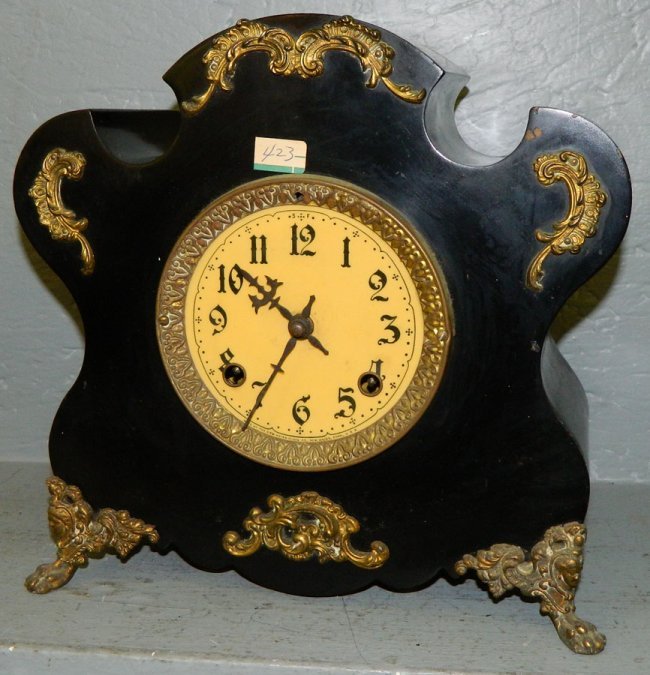 New Haven 8 day  clock w brass attachments.