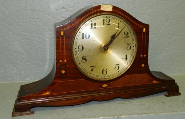 Inlaid mahogany striker clock w/ brass dial.