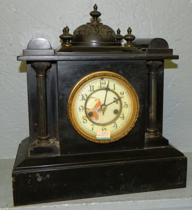 Waterbury 8 day striker clock w/ brass bell top.