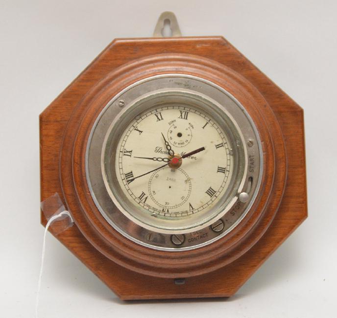 Thomas Mercer Ships Clock mounted on a wood base.  Dia