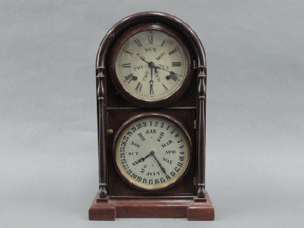 AN E.N. WELCH ITALIAN NO. 3 DOUBLE DIAL CALENDAR CLOCK