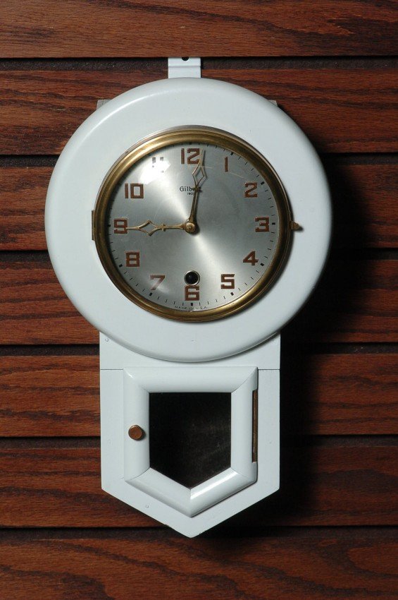 A GILBERT MINIATURE SCHOOL HOUSE CLOCK