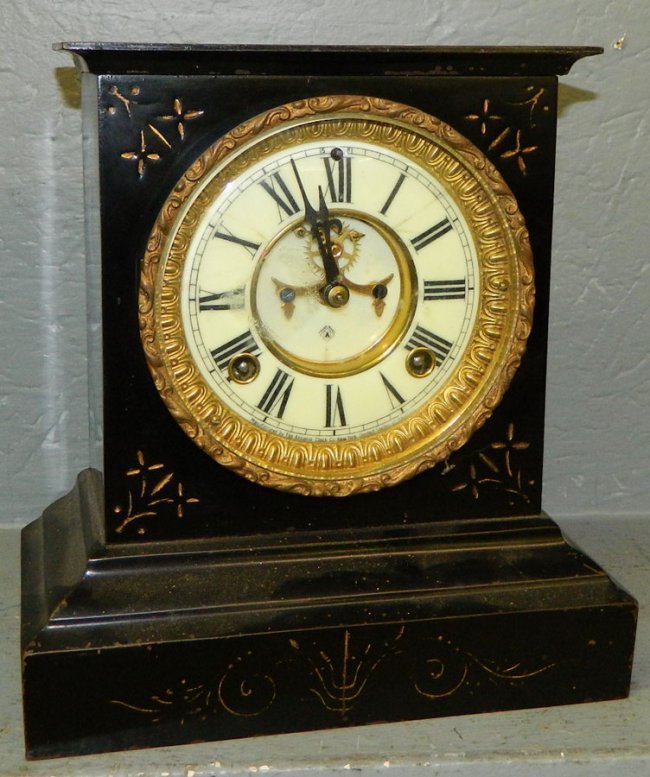 Ansonia iron case clock w/outside escapement.