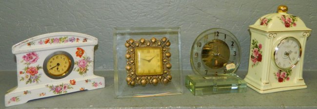 2 small acrylic and 2 small porcelain clocks.
