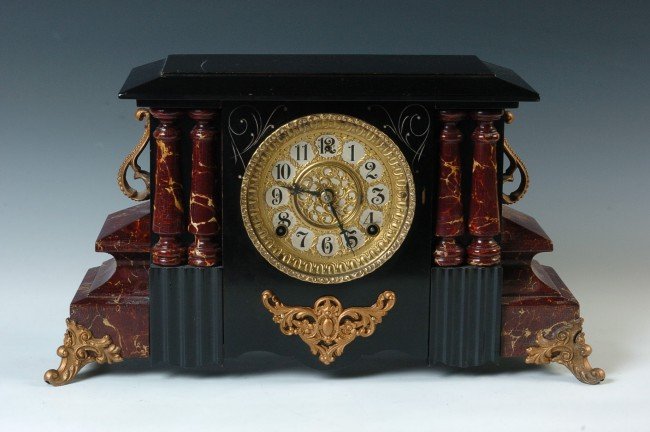 A GILBERT BLACK AND FAUX RED MARBLE MANTEL CLOCK