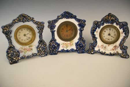 THREE SMALL FLOW BLUE CHINA CASE CLOCKS