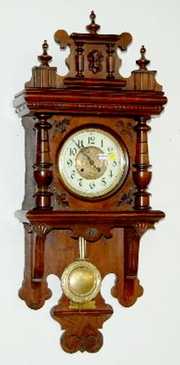 Antique Walnut Carved Free Swinger Clock