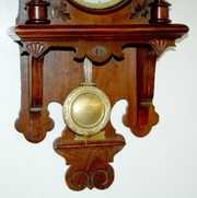 Antique Walnut Carved Free Swinger Clock