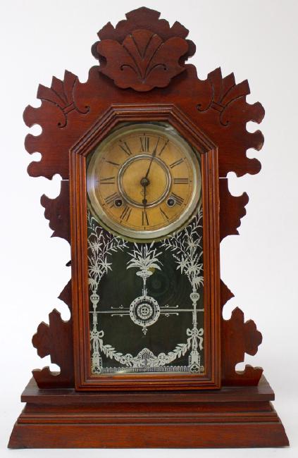 Early 20th century pressed Oak case ‘Laurel’ model gingerbread clock, by Gilbert Clock Co