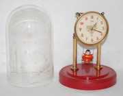 Swinging Doll Dome Clock