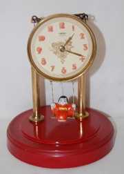 Swinging Doll Dome Clock