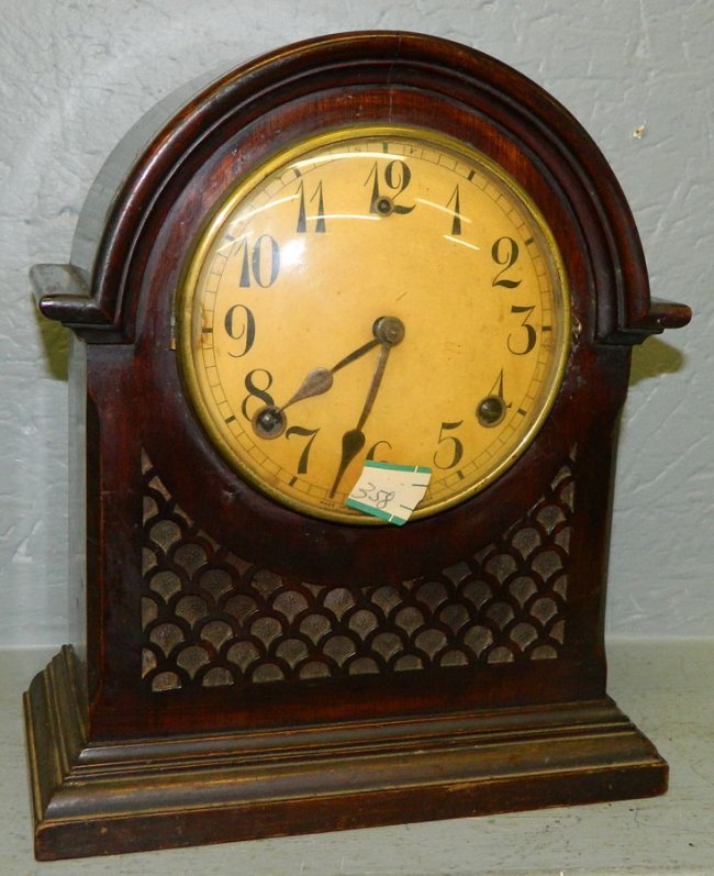 Gilbert carved walnut 8 day clock.