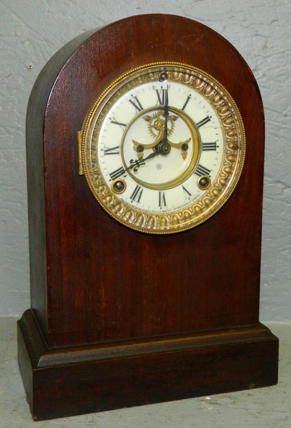 Round top mahogany Ansonia shelf clock.